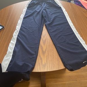 Small navy blue Nike windbreaker pants